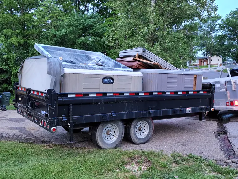 A trailer loaded with spas on the move